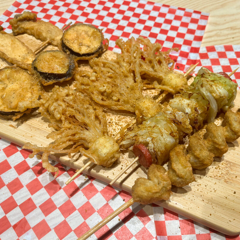 fried skewers on a table